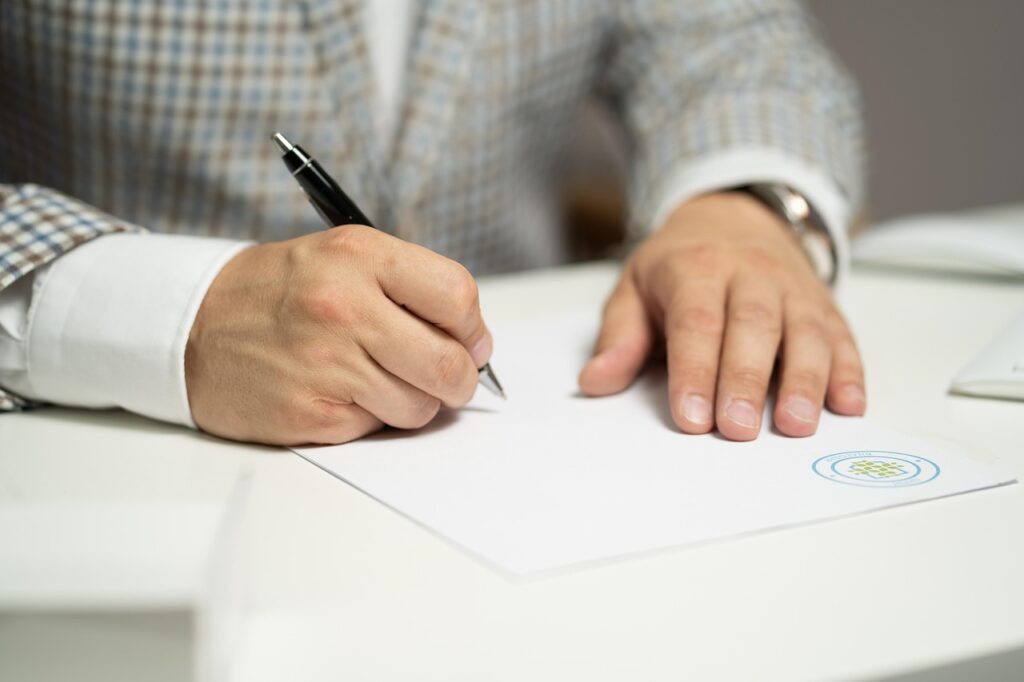 job seeker reviewing benefits package documents and salary comparison spreadsheet
