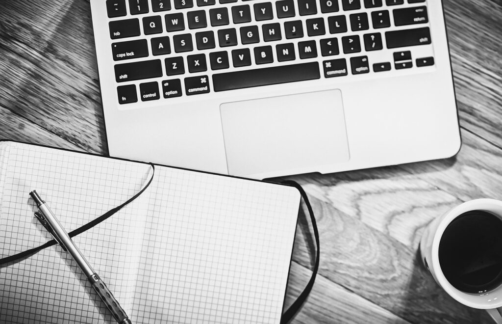 person working from home laptop coffee desk remote job