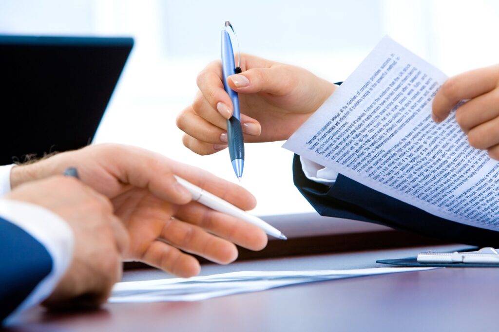 professional person at desk reviewing career documents thoughtfully
